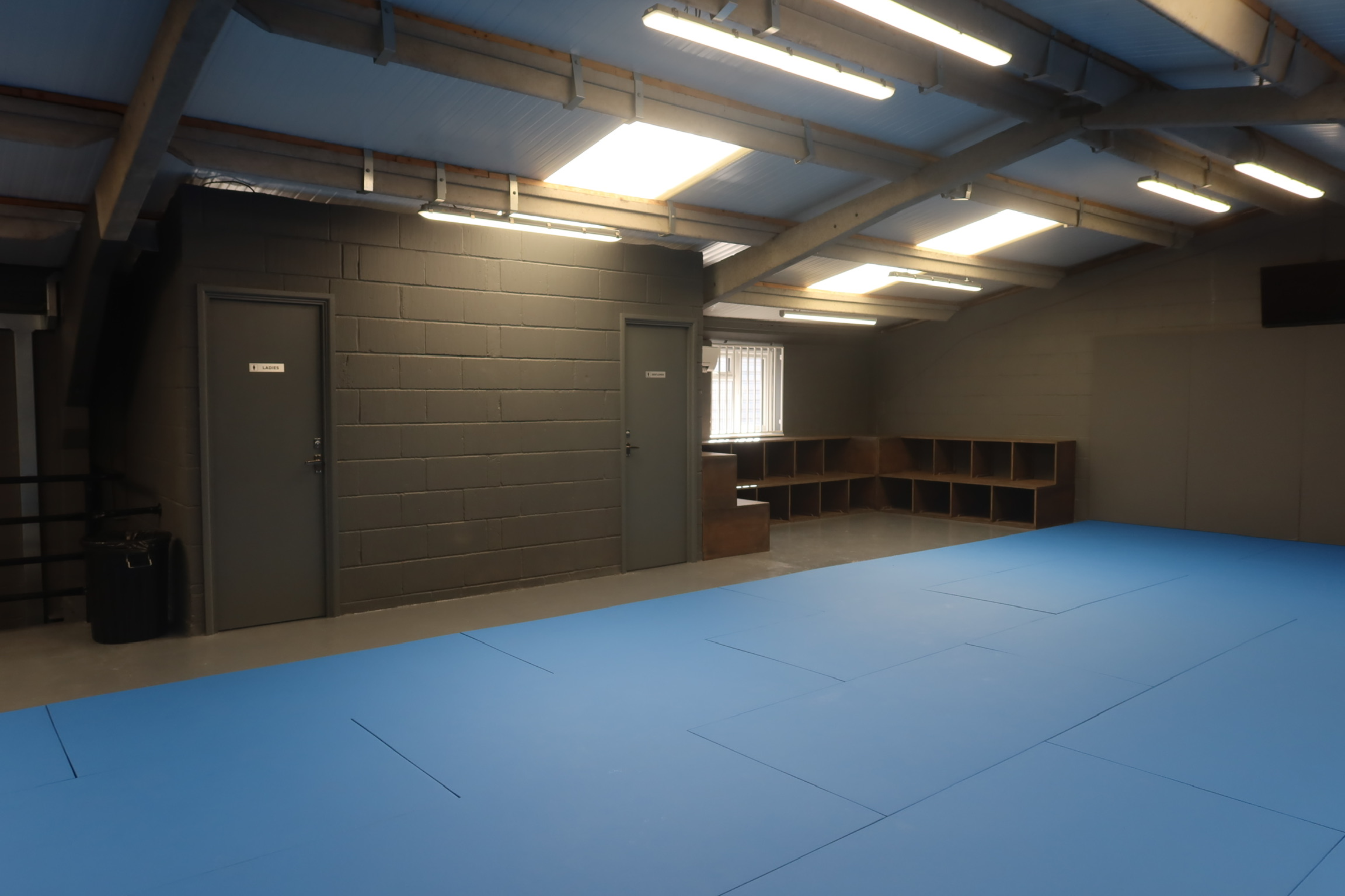 Upstairs changing area with lockers and toilets